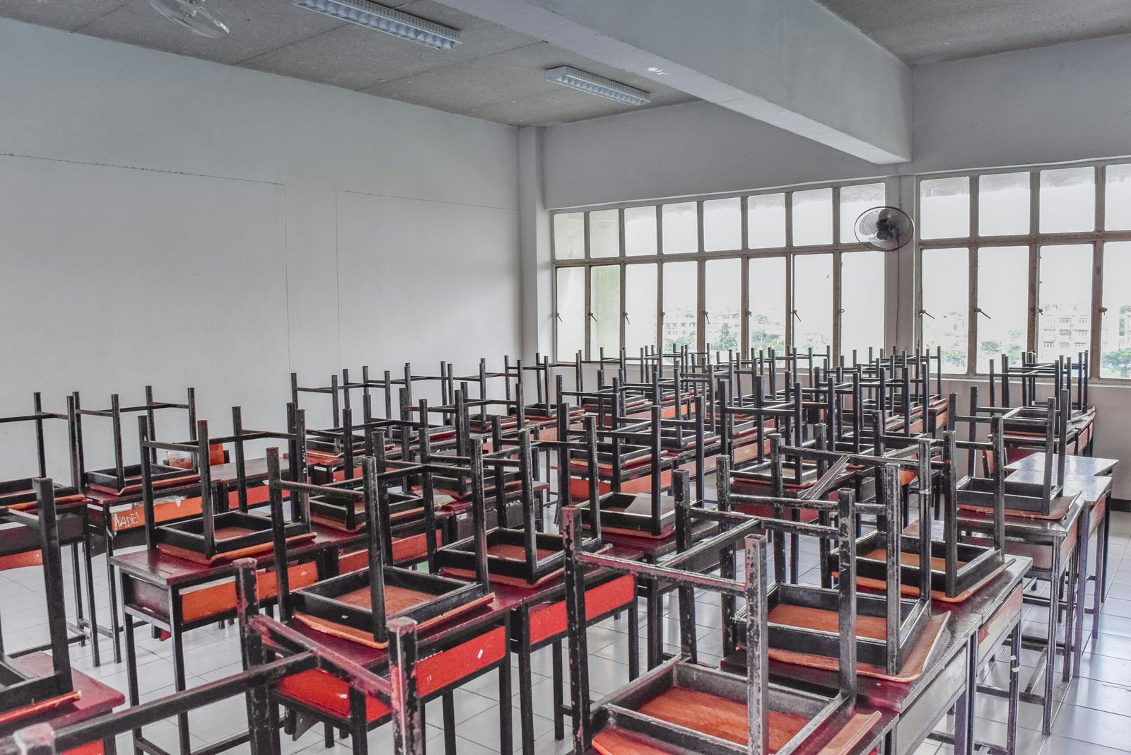 A large room filled with lots of red chairs