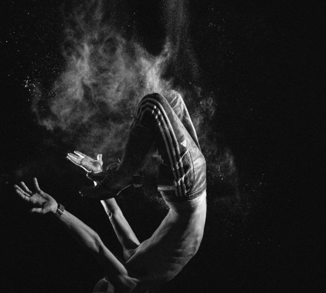 a black and white photo of a person floating in the air