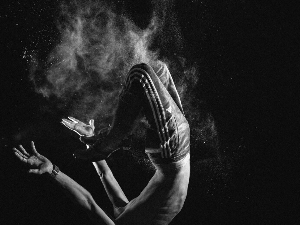 a black and white photo of a person floating in the air