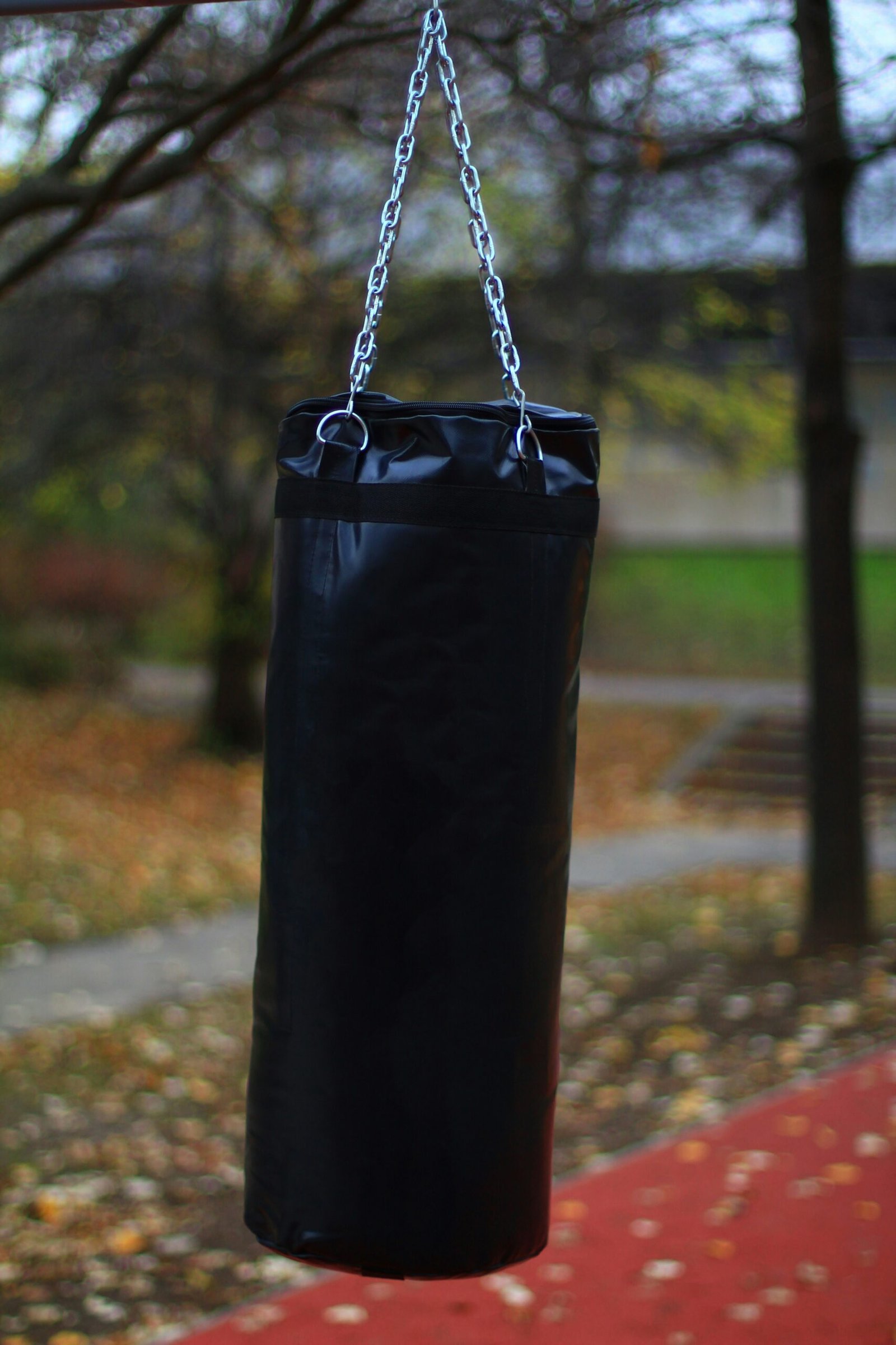 A heavy punching bag hangs outside.