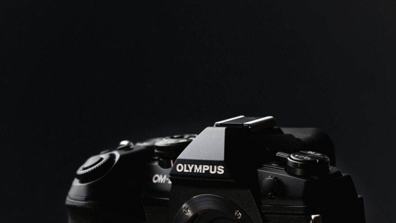 a close up of a camera on a black background